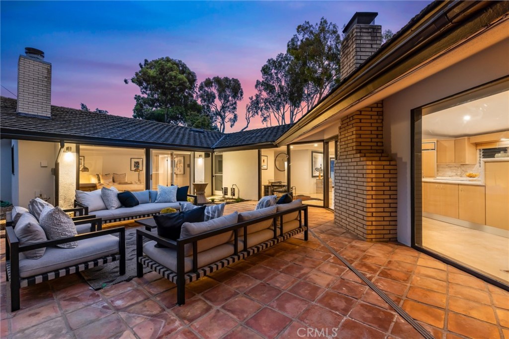 Palos Verdes Peninsula, 90274 - Photo 23 of 47 a building outdoor space with patio furniture and potted plants