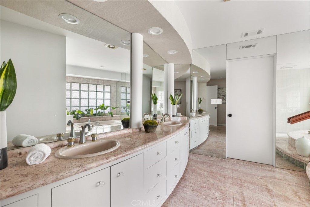 Palos Verdes Peninsula, 90274 - Photo 32 of 47 a spacious bathroom with a granite countertop double vanity sink mirror and shower