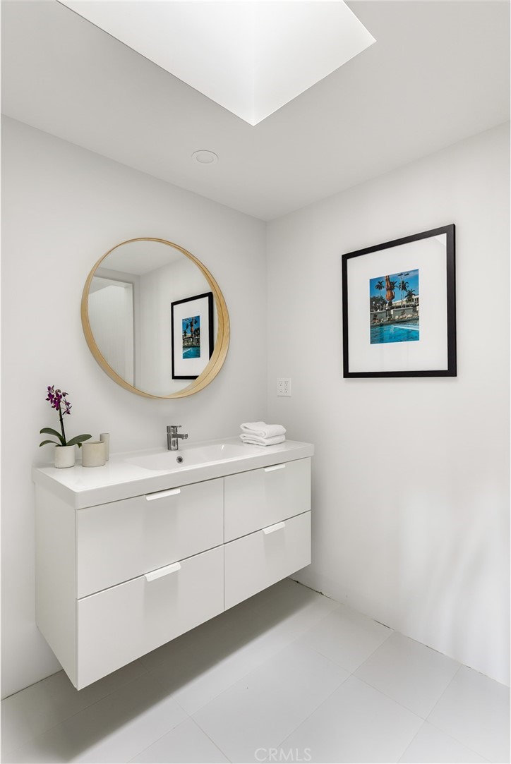 Palos Verdes Peninsula, 90274 - Photo 34 of 47 a bathroom with a sink and a mirror