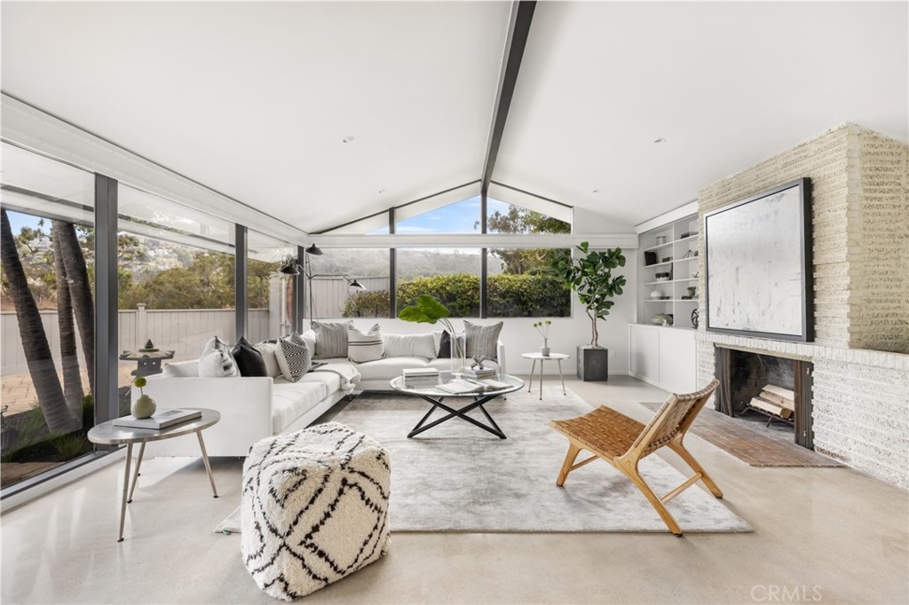 Palos Verdes Peninsula, 90274 - Photo 5 of 47 a living room with fireplace furniture and a large window