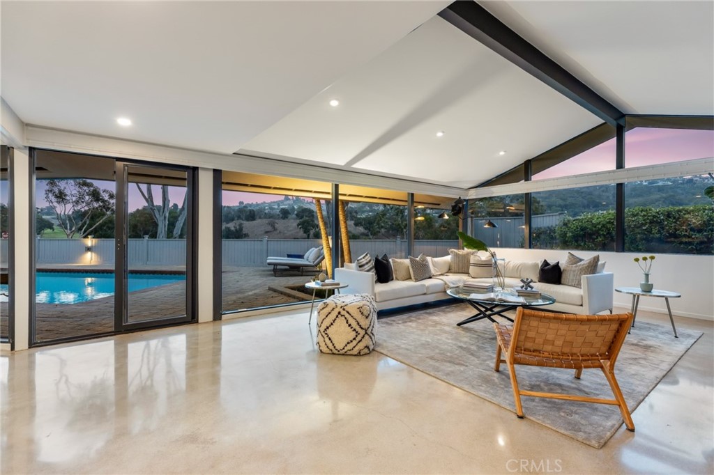 Palos Verdes Peninsula, 90274 - Photo 8 of 47 a living room with patio furniture and a large window