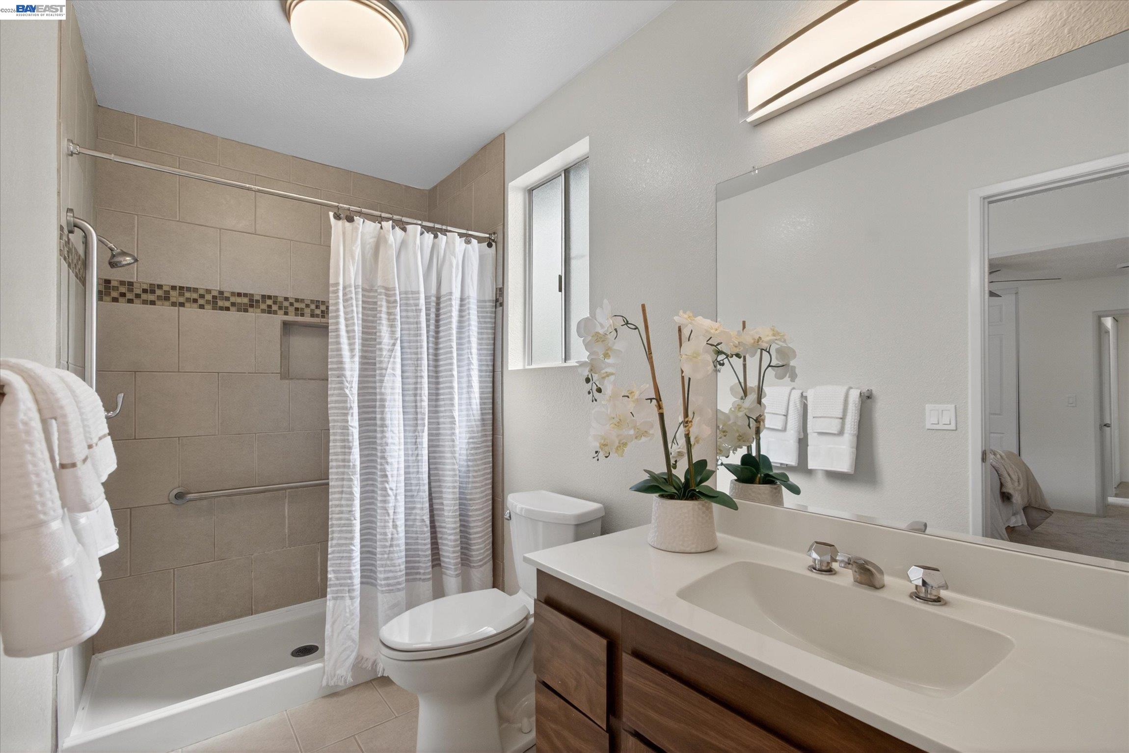 910 Miller Avenue Vallejo, CA 94591 - Photo 20 of 27 a bathroom with a sink toilet and shower
