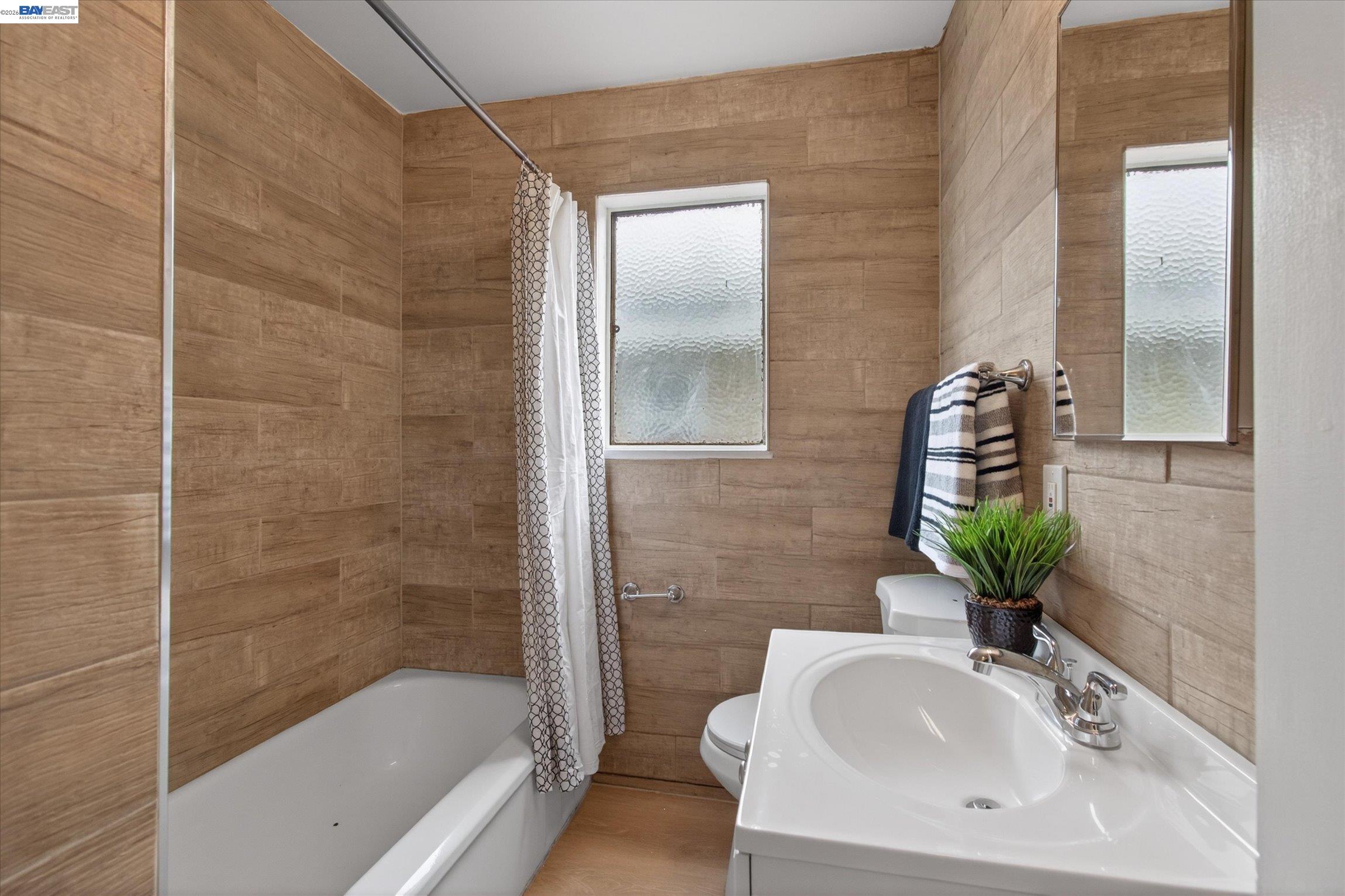 910 Miller Avenue Vallejo, CA 94591 - Photo 21 of 27 a bathroom with a sink and a mirror