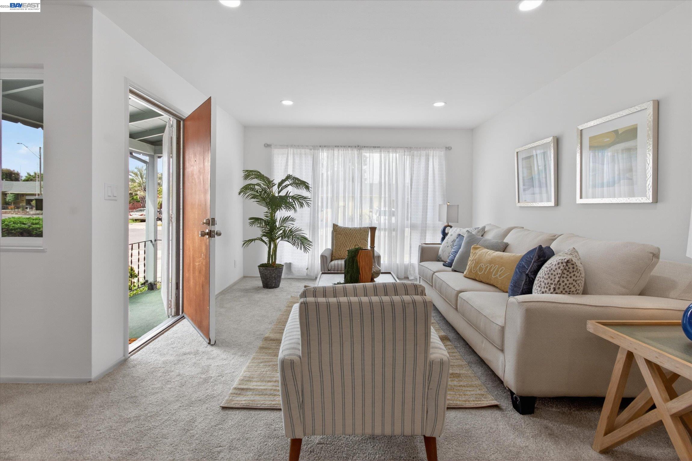 910 Miller Avenue Vallejo, CA 94591 - Photo 7 of 27 a living room with furniture and a potted plant
