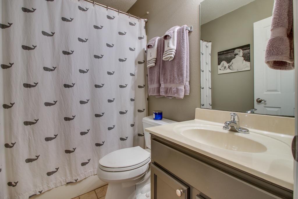 2114 Spring Hill Circle Spring Hill, TN 37174 - Photo 15 of 17 a bathroom with a sink and a mirror