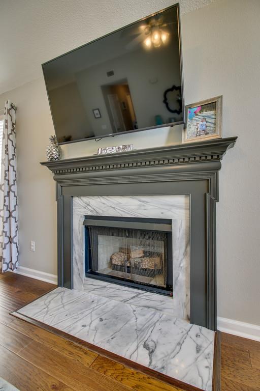 2114 Spring Hill Circle Spring Hill, TN 37174 - Photo 5 of 17 a view of fireplace in livingroom with wooden floor