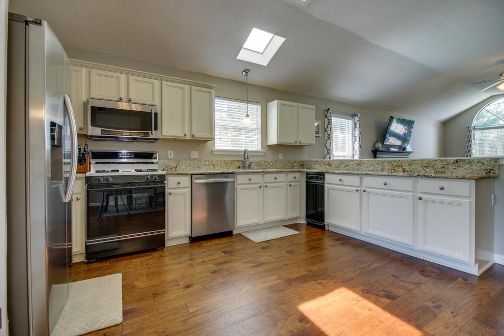 2114 Spring Hill Circle Spring Hill, TN 37174 - Photo 8 of 17 a kitchen with a sink white cabinets and stainless steel appliances