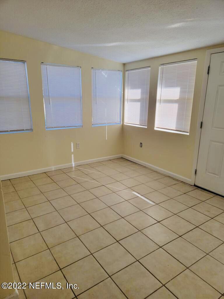 289 Las Olas Road St. Augustine, FL 32084 - Photo 3 of 14 a view of an empty room and a window