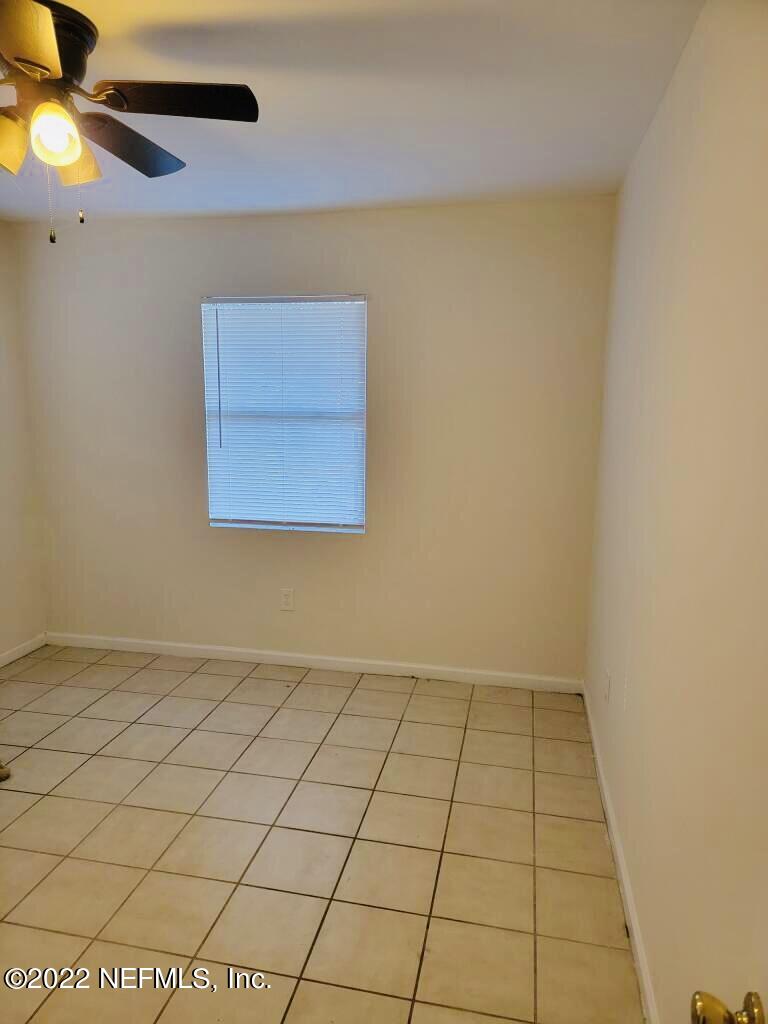 289 Las Olas Road St. Augustine, FL 32084 - Photo 5 of 14 a view of an empty room and window