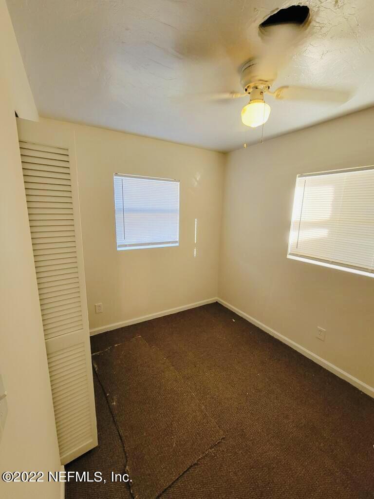 289 Las Olas Road St. Augustine, FL 32084 - Photo 10 of 14 an empty room with a window