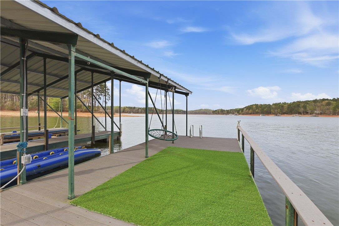 501 Capri Point Lavonia, GA 30553 - Photo 38 of 50 This tranquil waterfront setting includes a private covered dock for enjoying serene lake views.