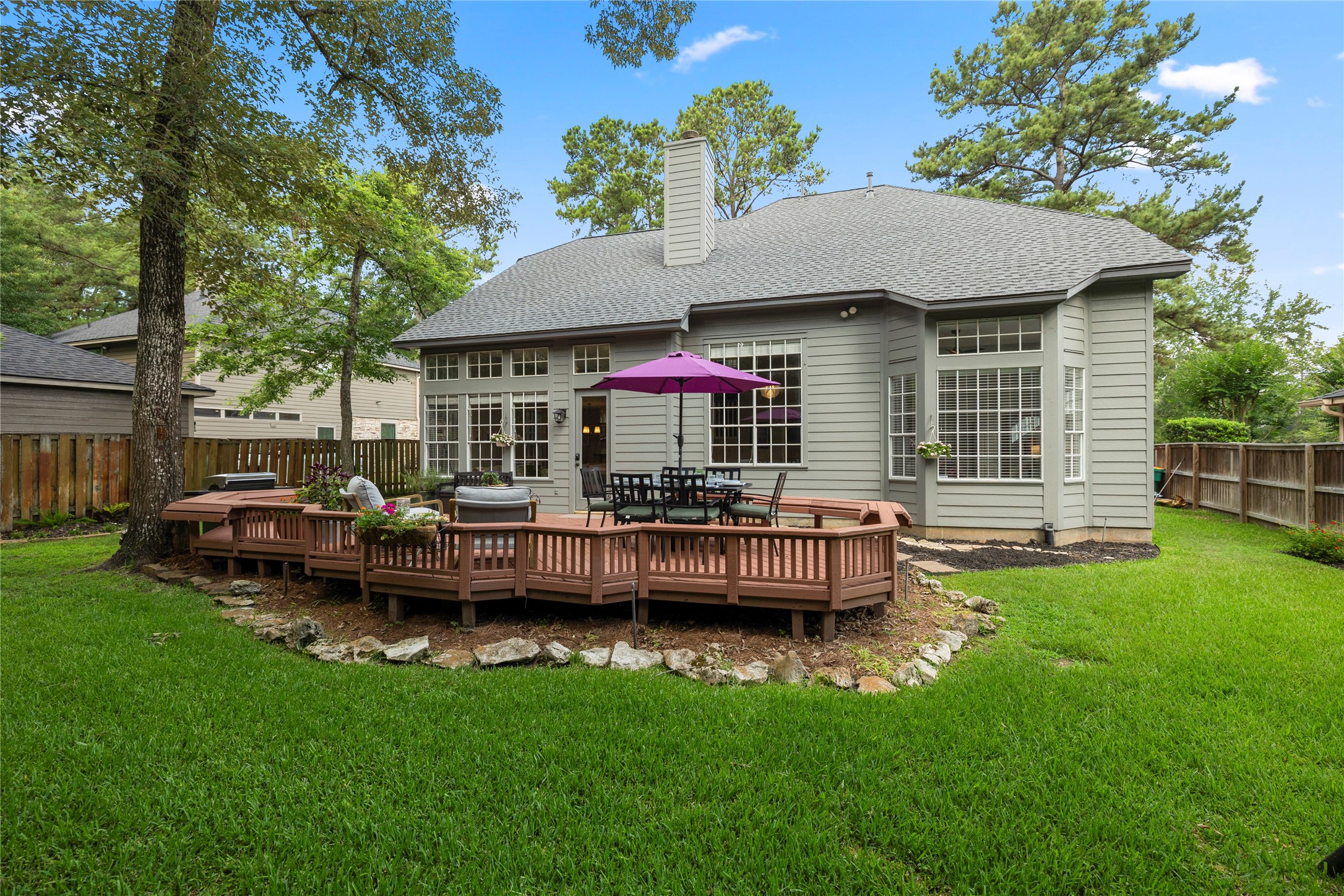 102 Treescape Circle Spring, TX 77381 - Photo 26 of 40 Spacious backyard retreat that includes an expansive deck and green space too!