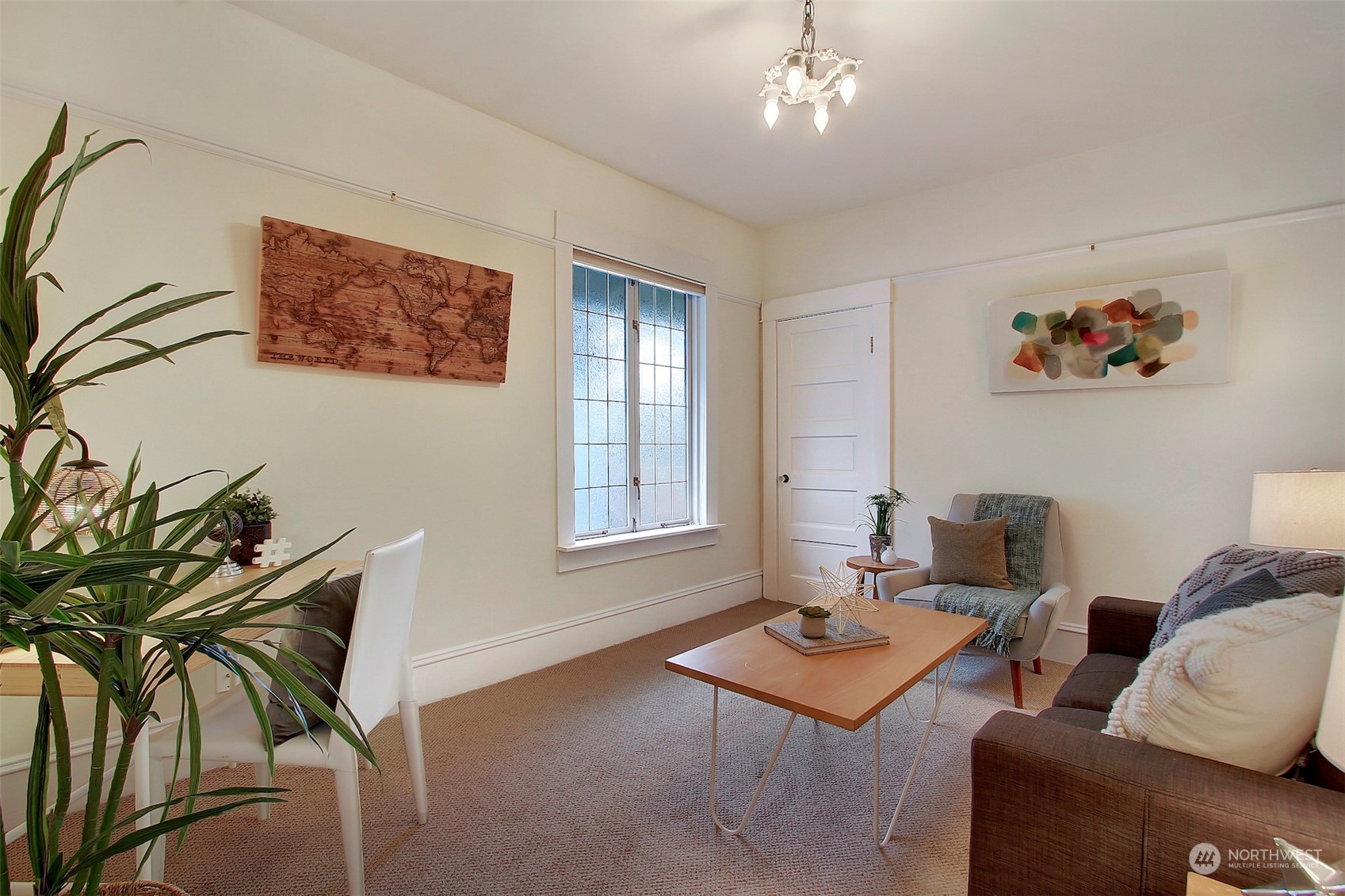 3912 Burke Avenue North Seattle, WA 98103 - Photo 12 of 39 a living room with furniture and a potted plant