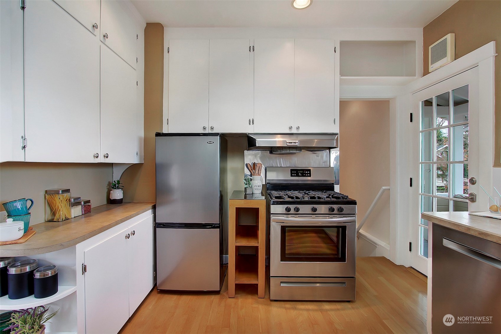 3912 Burke Avenue North Seattle, WA 98103 - Photo 16 of 39 a kitchen with a stove and a refrigerator