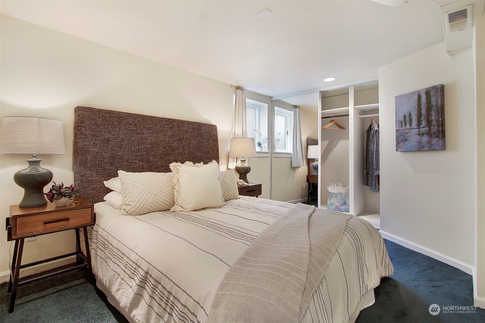 3912 Burke Avenue North Seattle, WA 98103 - Photo 17 of 39 a bedroom with a bed and wooden floor