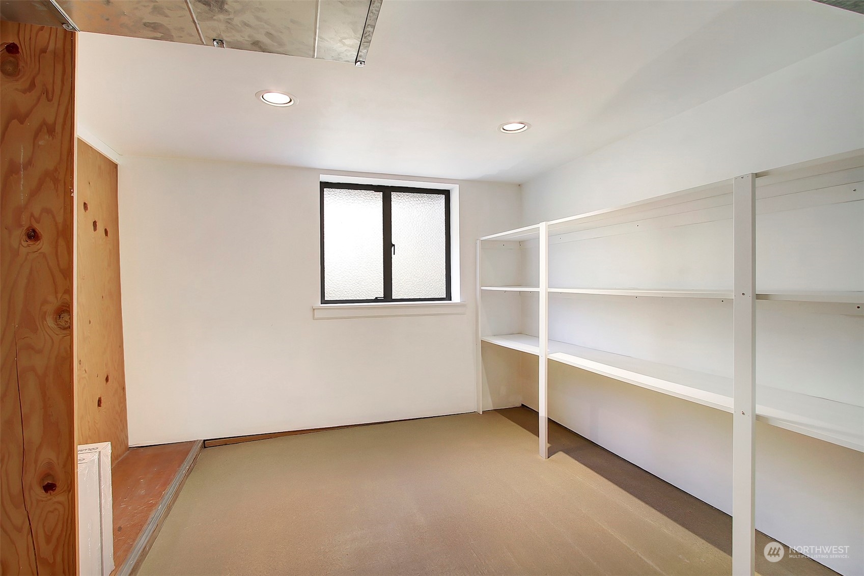 3912 Burke Avenue North Seattle, WA 98103 - Photo 24 of 39 a view of an empty room with a window