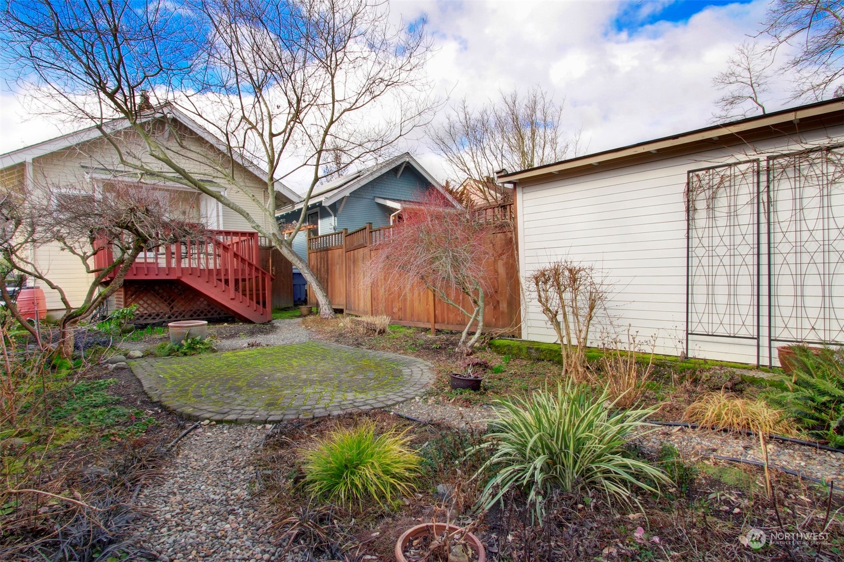 3912 Burke Avenue North Seattle, WA 98103 - Photo 30 of 39 a backyard of a house with garden and patio