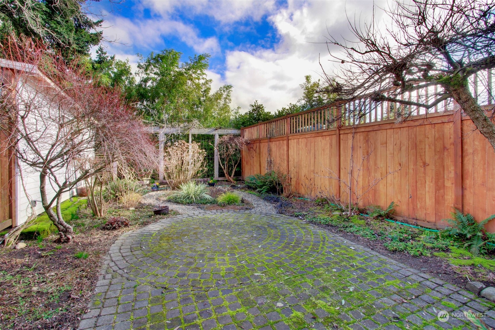 3912 Burke Avenue North Seattle, WA 98103 - Photo 31 of 39 a backyard of a house with lots of green space