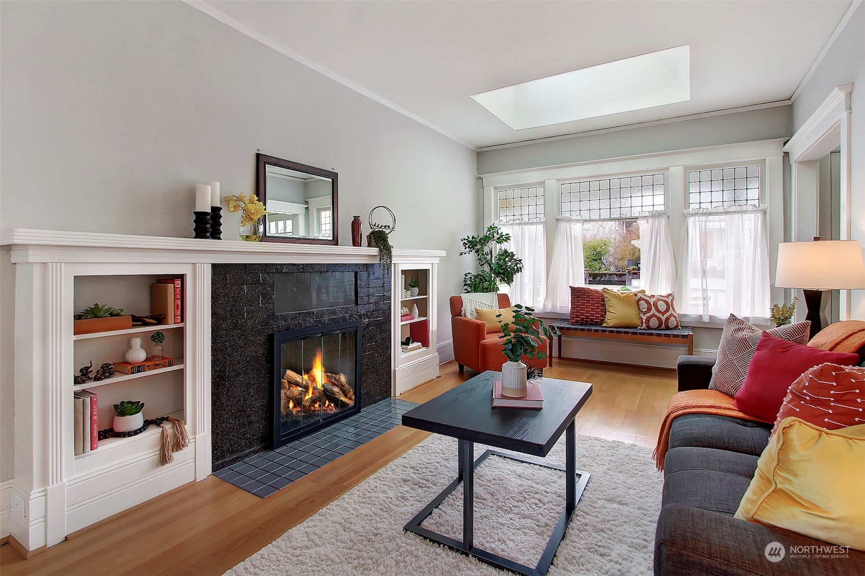3912 Burke Avenue North Seattle, WA 98103 - Photo 6 of 39 a living room with furniture and a fireplace