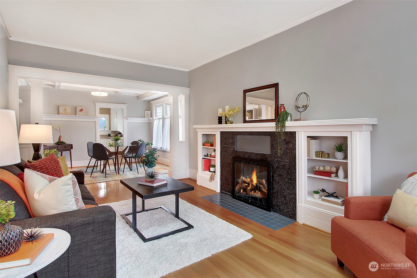3912 Burke Avenue North Seattle, WA 98103 - Photo 7 of 39 a living room with furniture and a fireplace