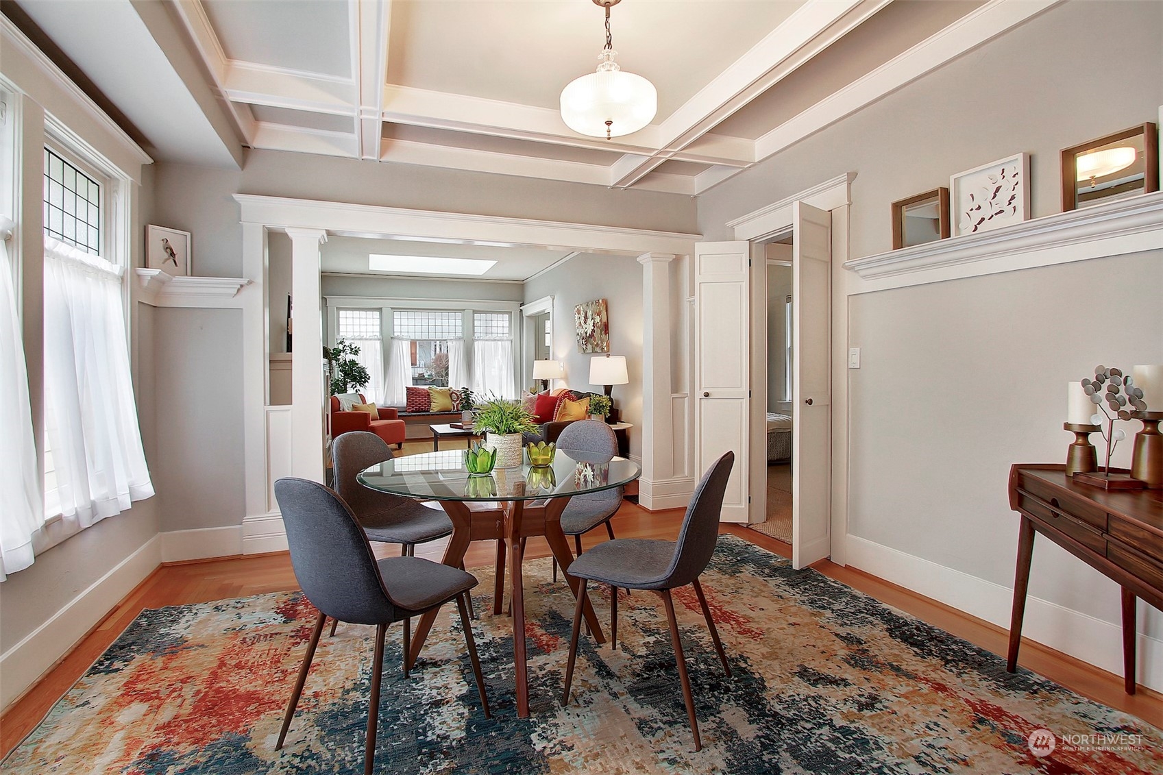3912 Burke Avenue North Seattle, WA 98103 - Photo 9 of 39 a view of a dining room with furniture and a chandelier