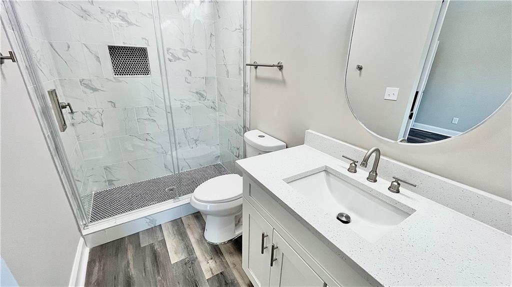 5 Green Road Griffin, GA 30224 - Photo 21 of 34 a bathroom with a sink a toilet and shower