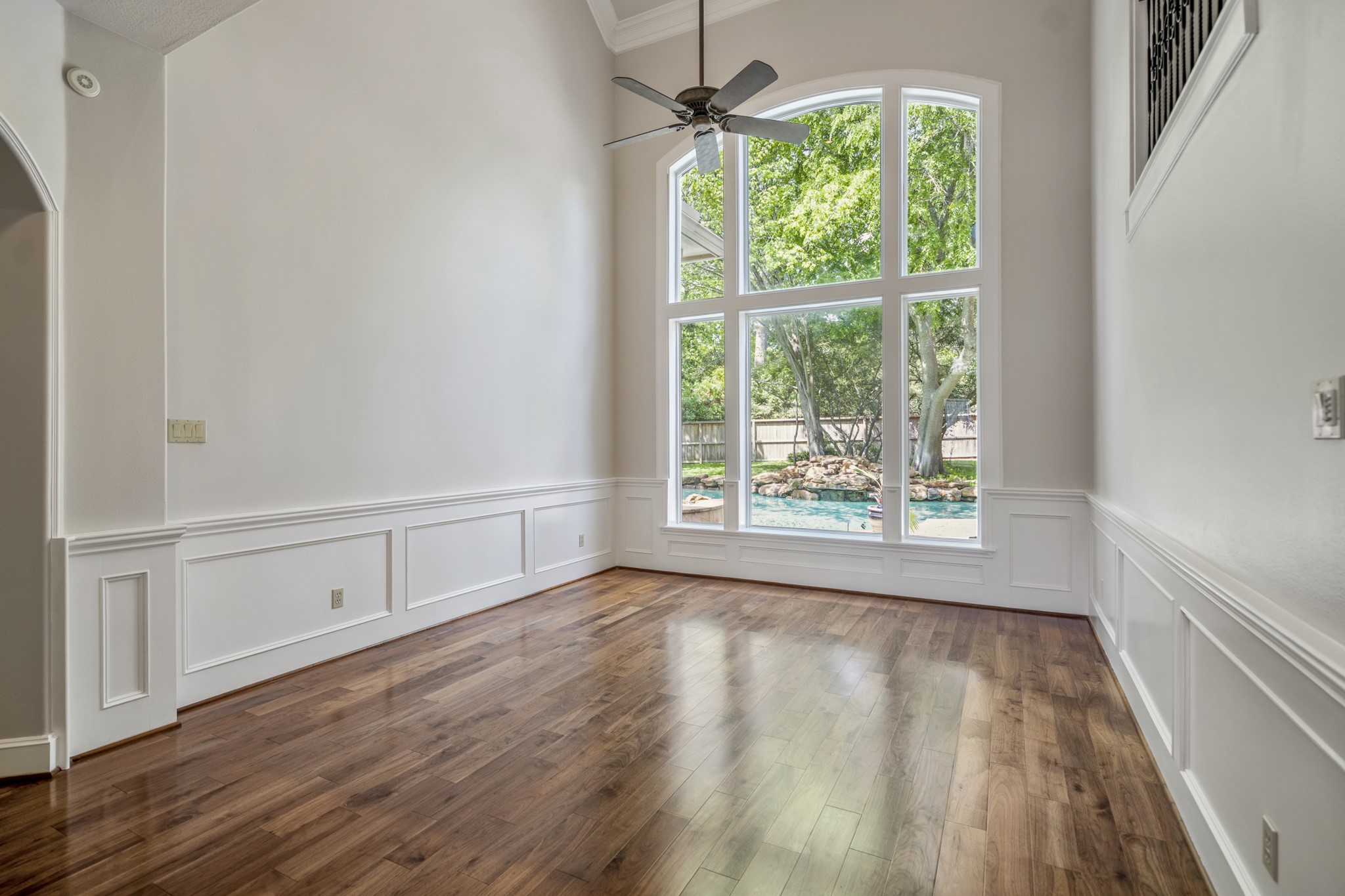 15 Lochbury Court Spring, TX 77379 - Photo 11 of 48 Large windows provide fantastic views from the formal living into the incredible backyard, while the continuous wide-plank hardwoods provide a seamless transition from the rest of the home and add a sense of warmth and permanence to the space.