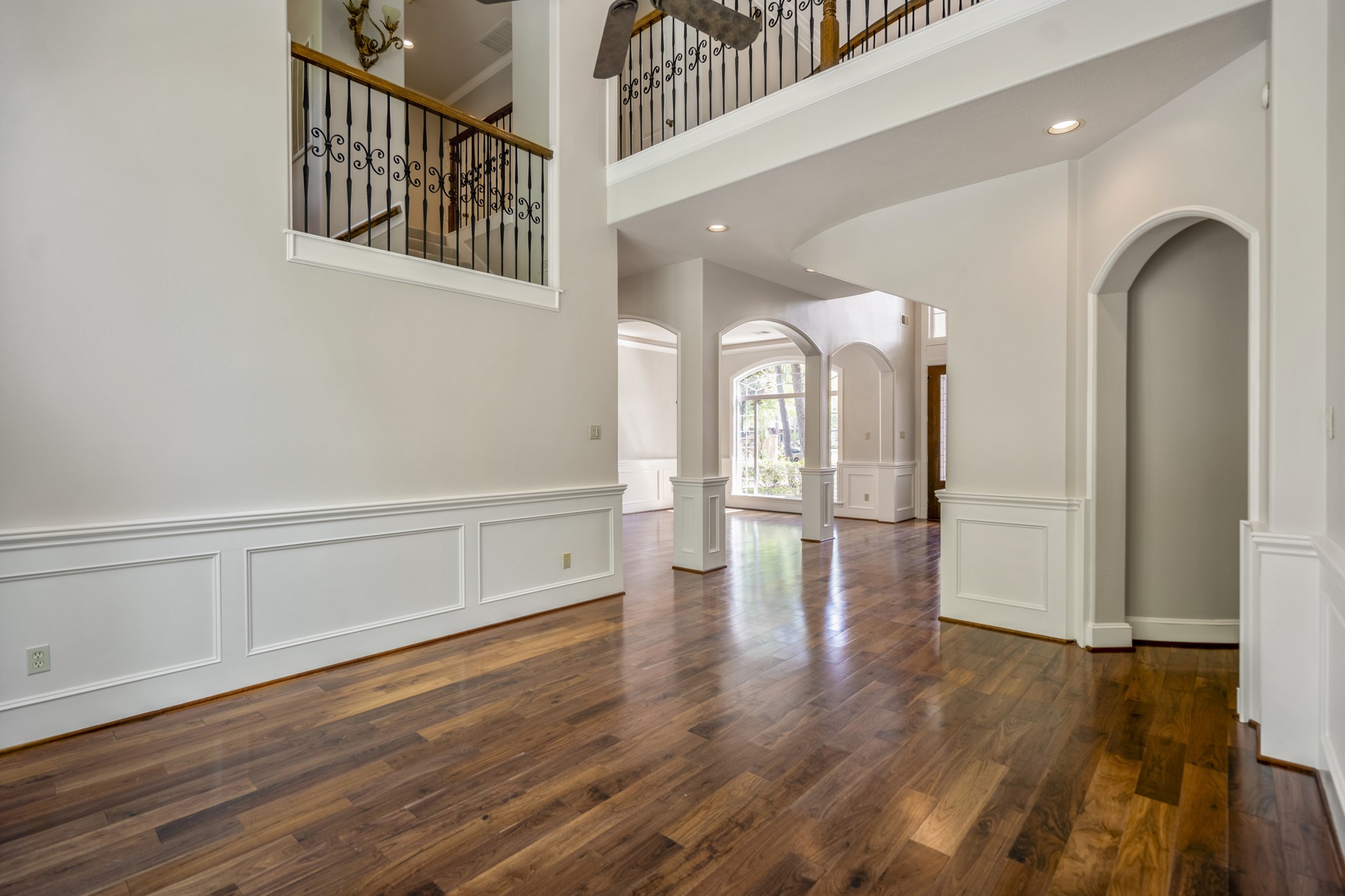 15 Lochbury Court Spring, TX 77379 - Photo 12 of 48 The formal living room is wrapped in elegant traditional wainscoting and deep crown molding, giving it a distinguished feel that exudes professional success.