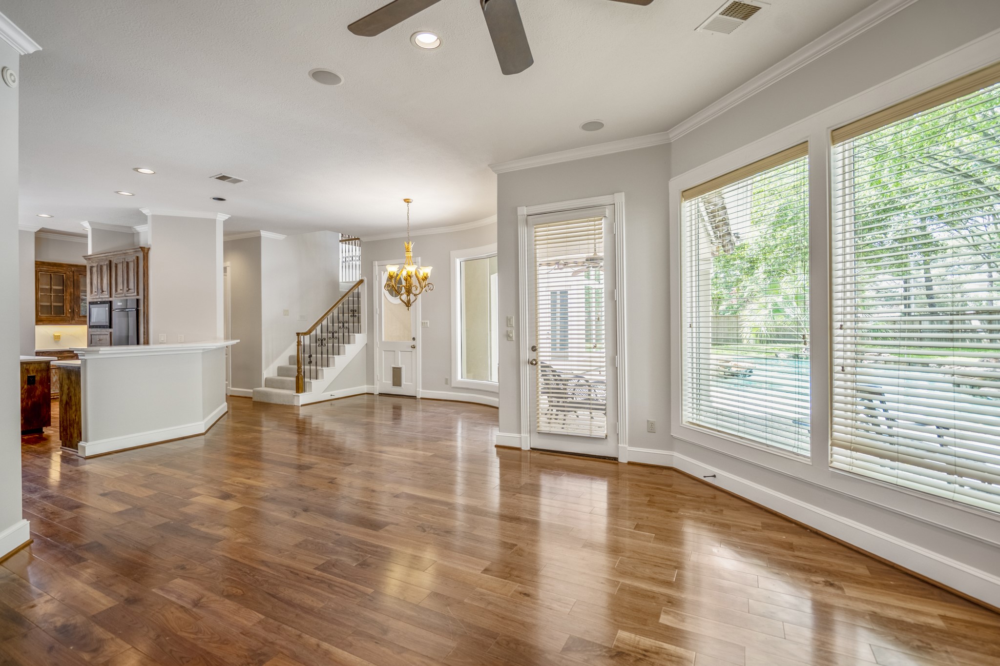 15 Lochbury Court Spring, TX 77379 - Photo 17 of 48 The den / family room offers a bank of three large windows, plus a glass-paned door that floods the room with natural light and offers a seamless view of the outdoor living area.