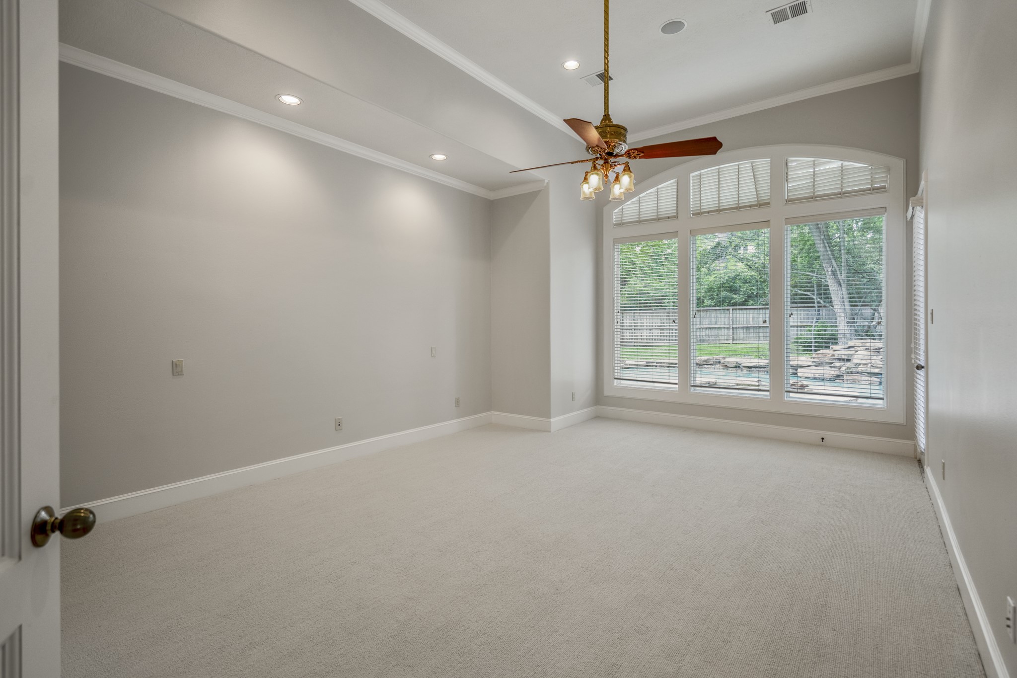 15 Lochbury Court Spring, TX 77379 - Photo 19 of 48 The large spacious primary suite features the most beautiful expansive views of the outdoors, as well as a luxurious retreat.