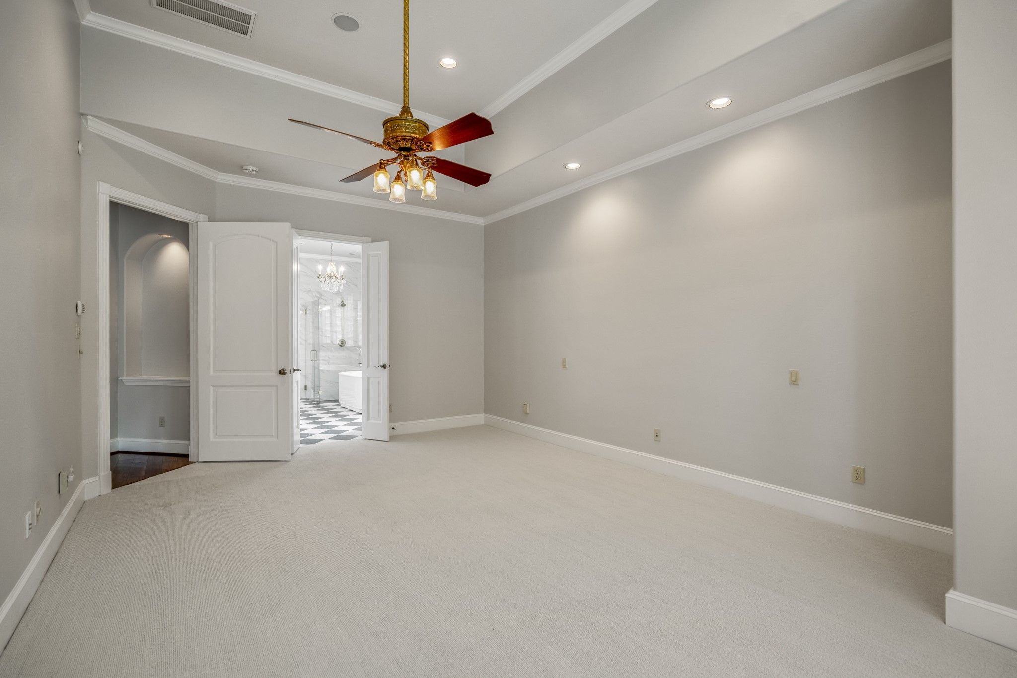 15 Lochbury Court Spring, TX 77379 - Photo 20 of 48 The trey style ceiling with overhead lighting and recent carpeting offers the tranquil setting to relax and unwind. Double doors lead to the updated en-suite bathroom.