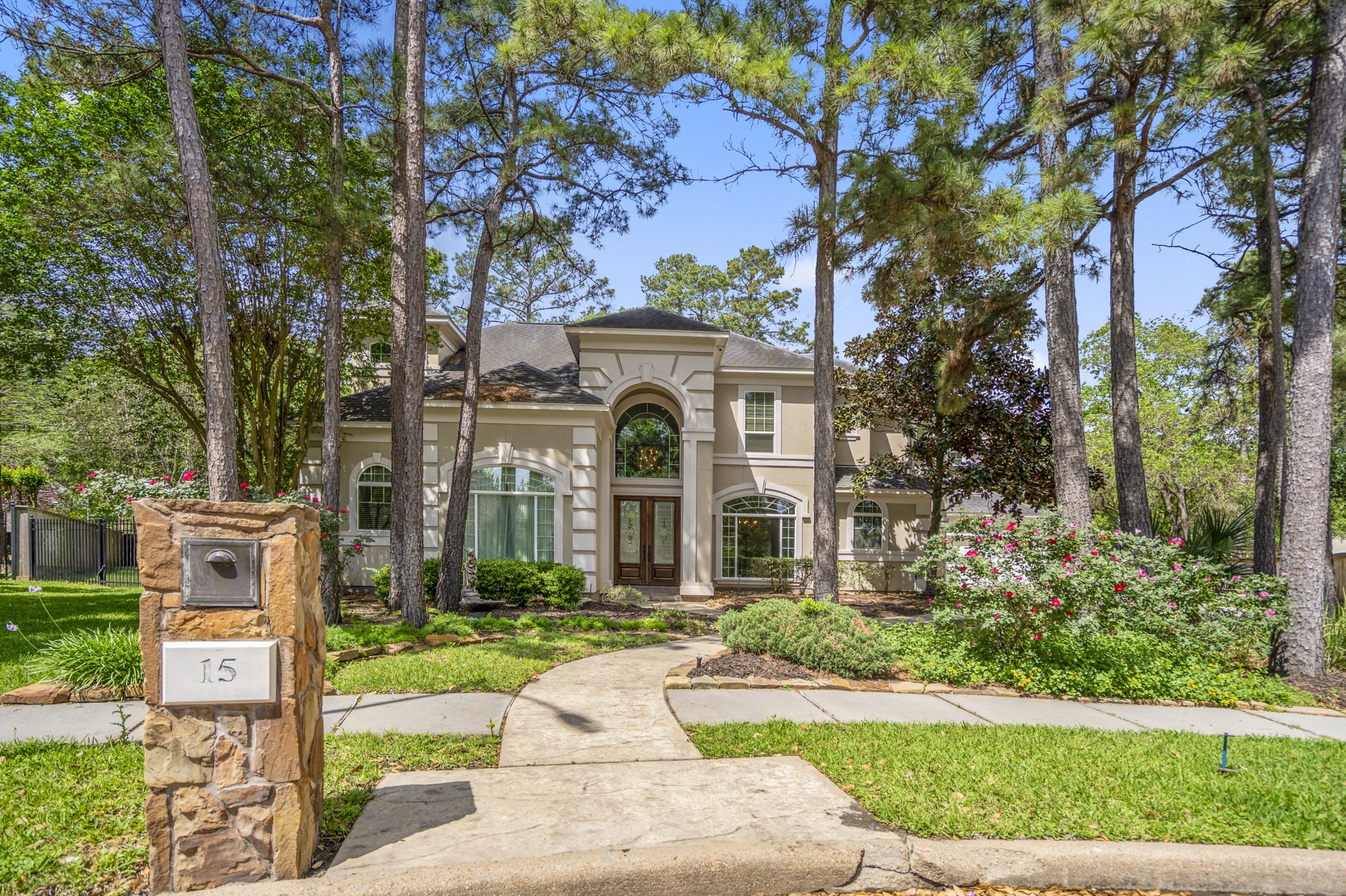 15 Lochbury Court Spring, TX 77379 - Photo 2 of 48 Great curb appeal offering mature landscaping, with established shade trees and a beautiful stucco elevation.