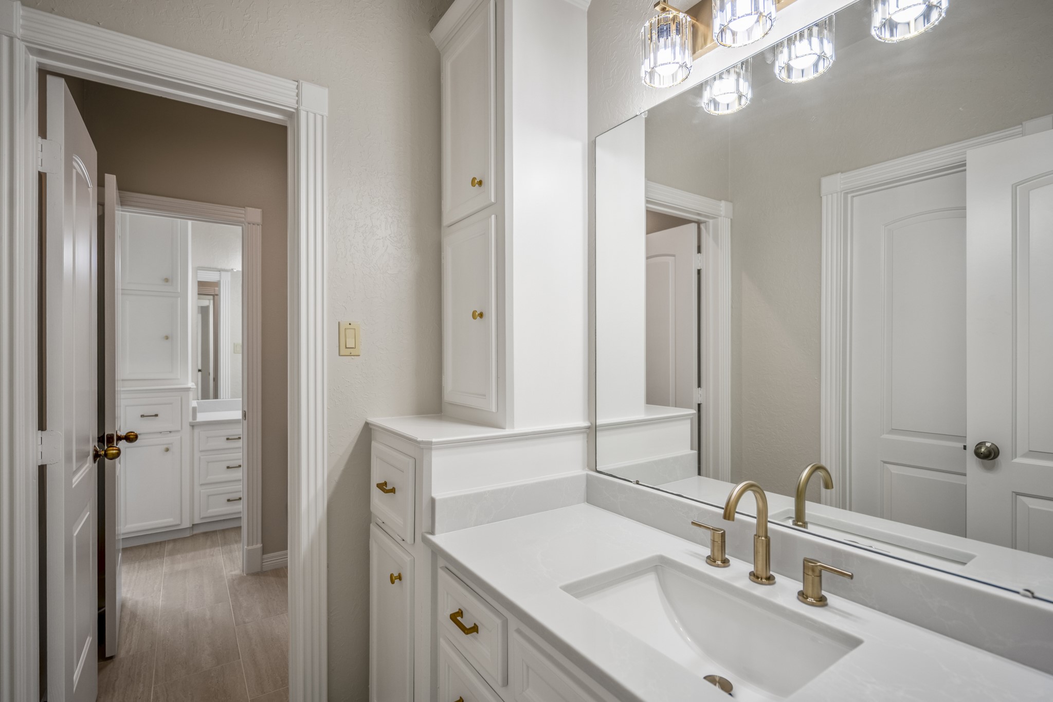 15 Lochbury Court Spring, TX 77379 - Photo 30 of 48 Another upstairs bathroom which has plenty of storage, beautiful quartz countertops, updated lighting and is just off the bedroom.