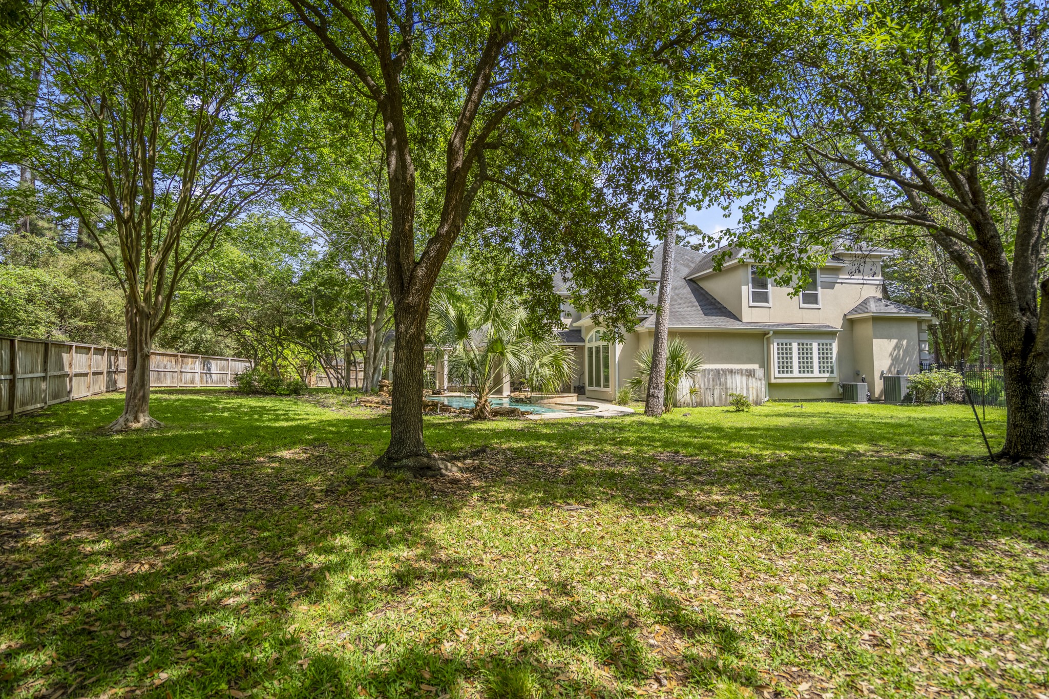 15 Lochbury Court Spring, TX 77379 - Photo 36 of 48 Enjoy the large backyard where you get to have fun whilst being surrounded by beautiful trees and established landscaping.