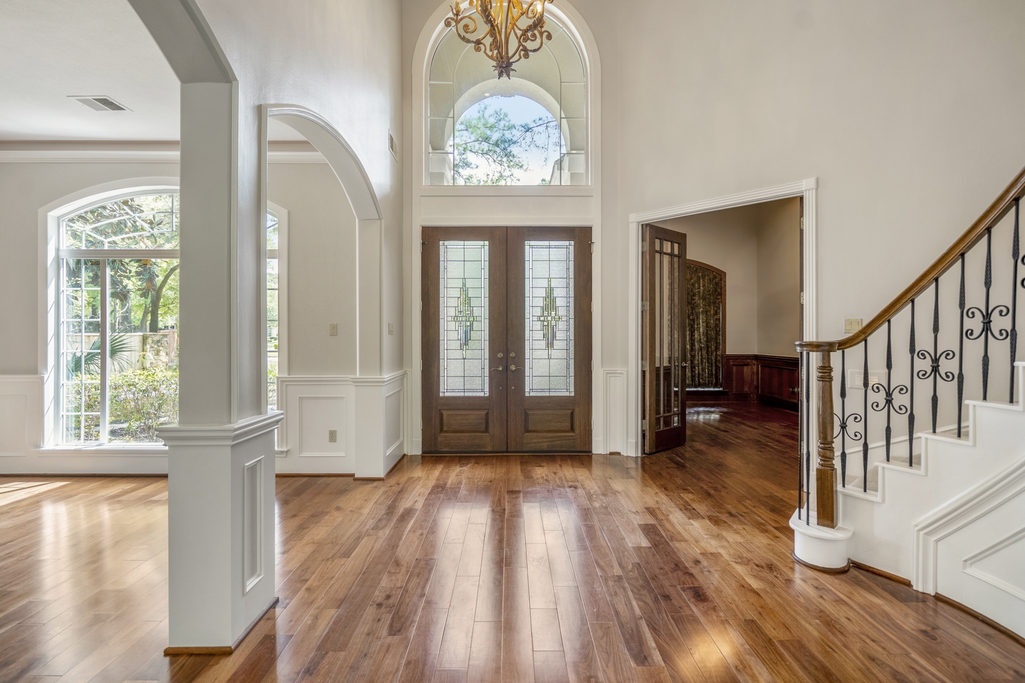 15 Lochbury Court Spring, TX 77379 - Photo 6 of 48 The 2-Story Foyer has soaring ceilings and an elegant arched transom window flood the space with natural light, creating an immediate sense of scale and luxury.