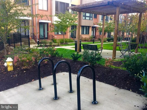 a view of a patio with table and chairs and potted plants