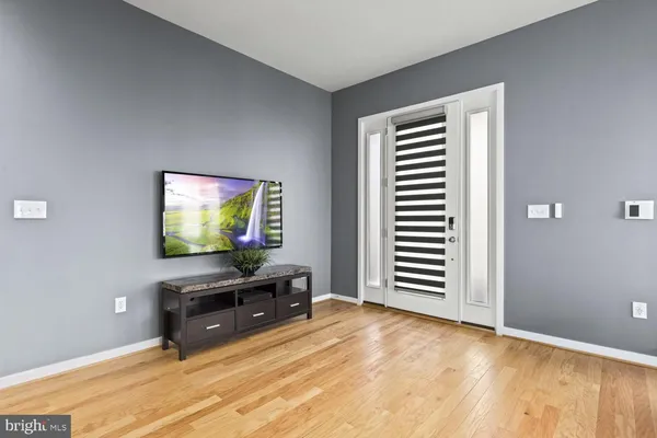 a view of a livingroom with furniture and a flat screen tv