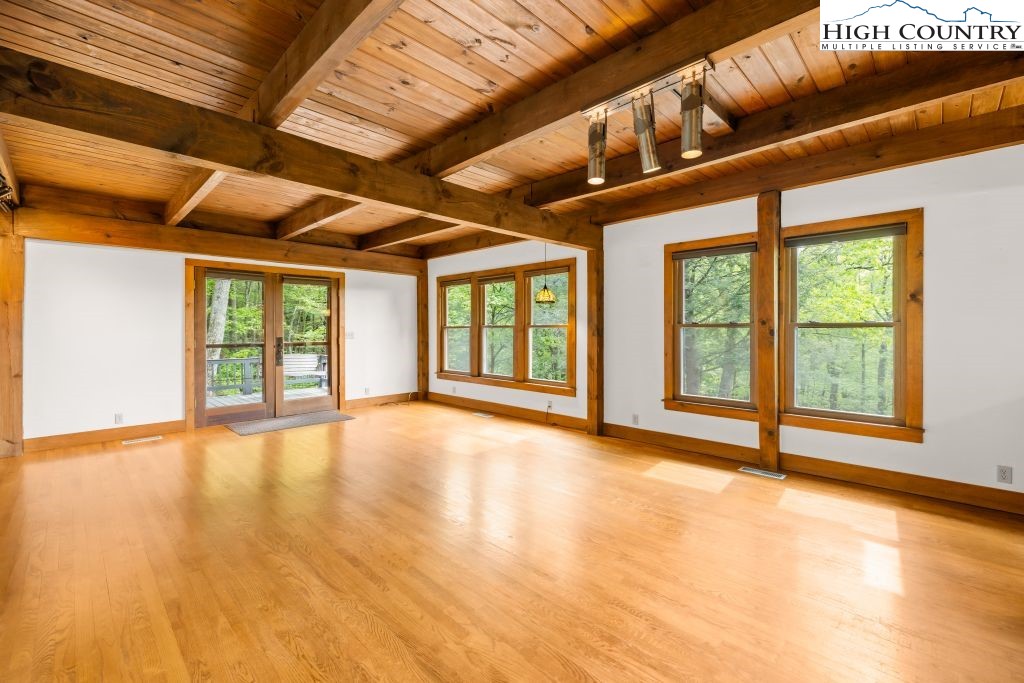 737 Tennant Road Newland, NC 28657 - Photo 12 of 38 a view of an empty room with windows