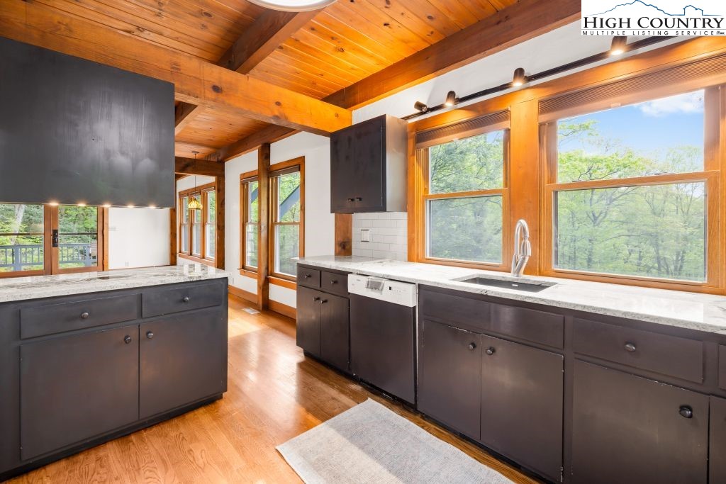 737 Tennant Road Newland, NC 28657 - Photo 13 of 38 a large kitchen with kitchen island granite countertop a large window