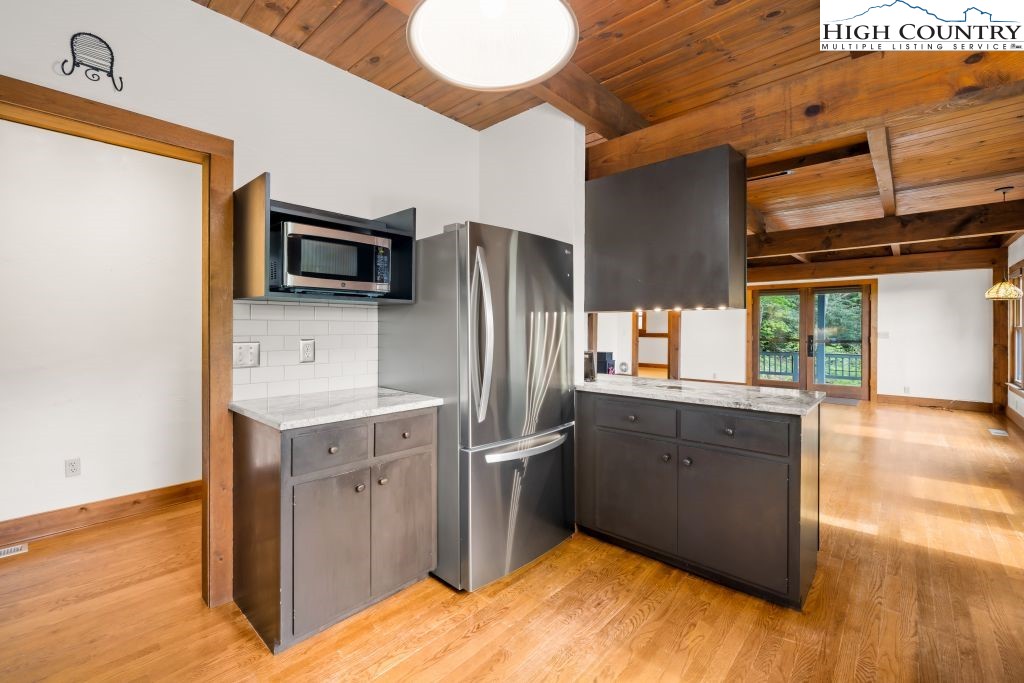 737 Tennant Road Newland, NC 28657 - Photo 14 of 38 a kitchen with stainless steel appliances granite countertop a refrigerator a stove and a sink