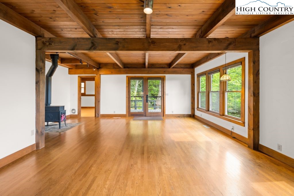 737 Tennant Road Newland, NC 28657 - Photo 16 of 38 a view of empty room with wooden floor and fan