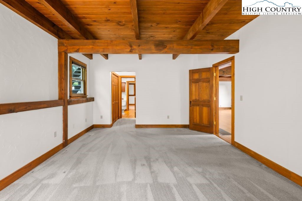737 Tennant Road Newland, NC 28657 - Photo 19 of 38 a view of a room with wooden floor and natural light
