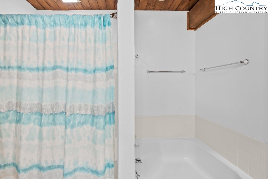 737 Tennant Road Newland, NC 28657 - Photo 21 of 38 a bathroom with a shower