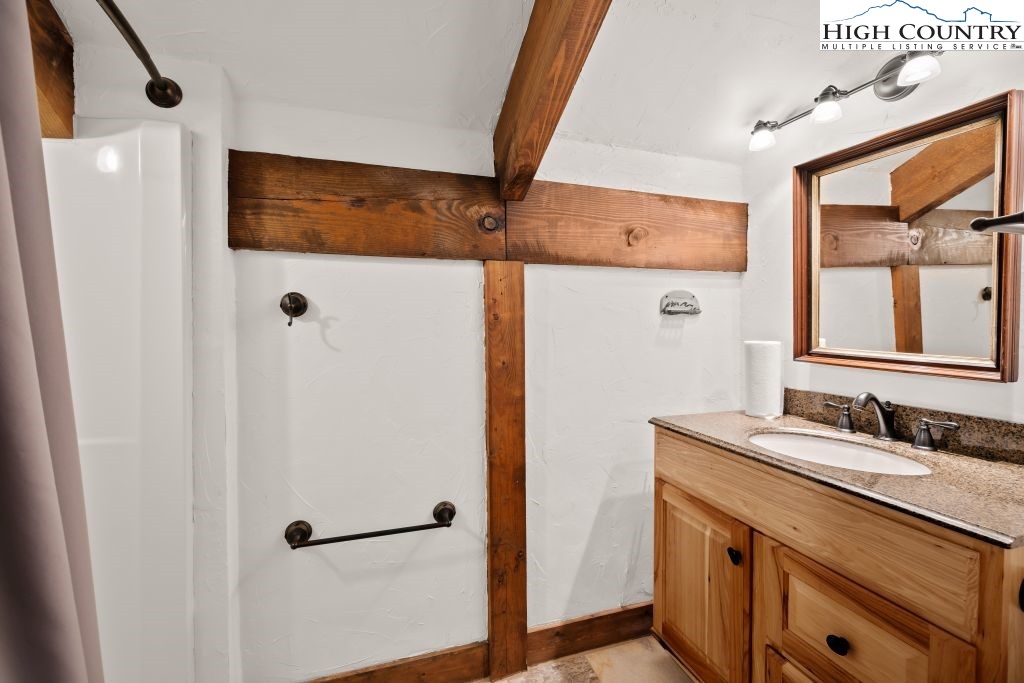 737 Tennant Road Newland, NC 28657 - Photo 26 of 38 a bathroom with a sink and a mirror