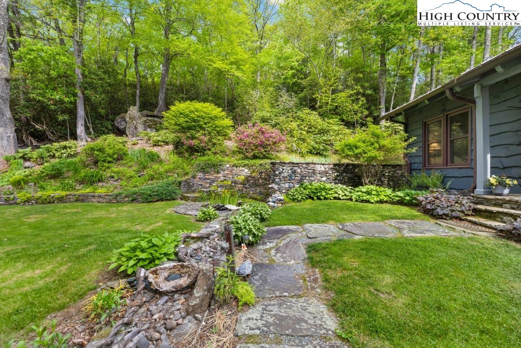 737 Tennant Road Newland, NC 28657 - Photo 4 of 38 a view of a garden with large trees