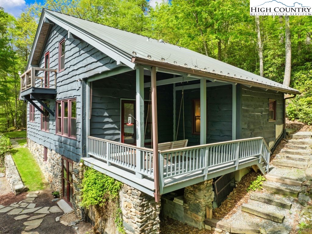 737 Tennant Road Newland, NC 28657 - Photo 6 of 38 a view of a house with a window and wooden fence