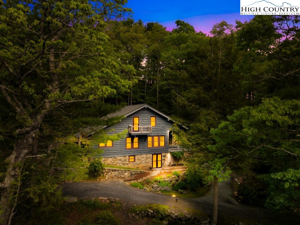 737 Tennant Road Newland, NC 28657 - Photo 7 of 38 a view of a big yard with plants and a small pool