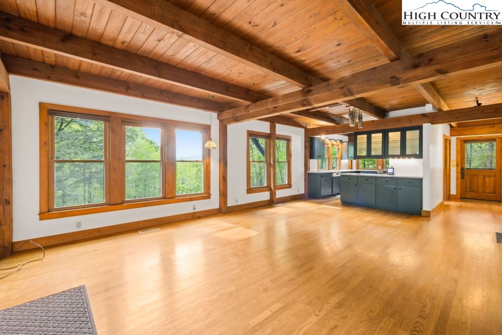 737 Tennant Road Newland, NC 28657 - Photo 9 of 38 a view of an empty room with a window and kitchen view