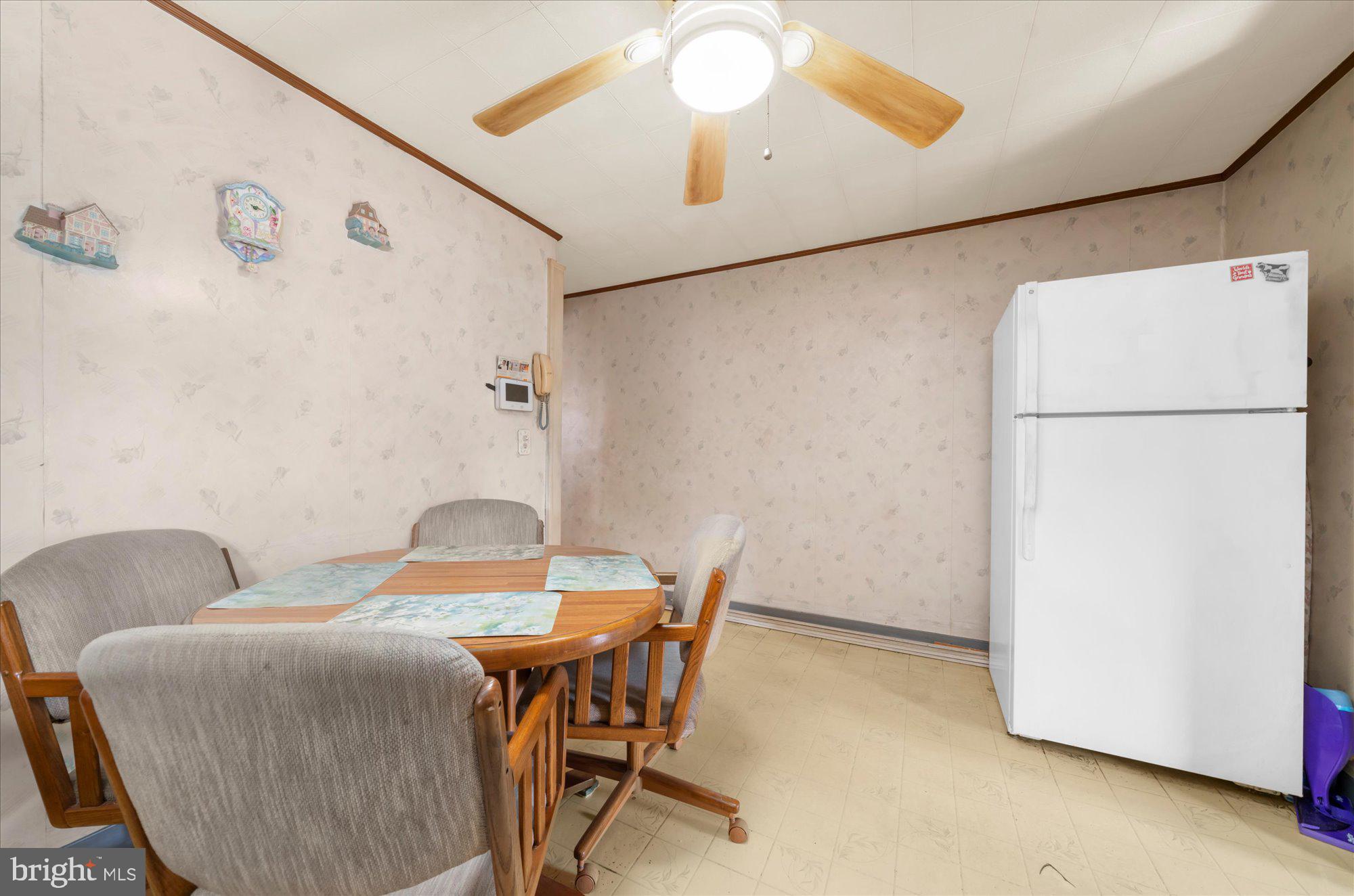 108 Fitzrandolph Avenue Hamilton, NJ 08610 - Photo 11 of 30 a dining room with furniture and a refrigerator