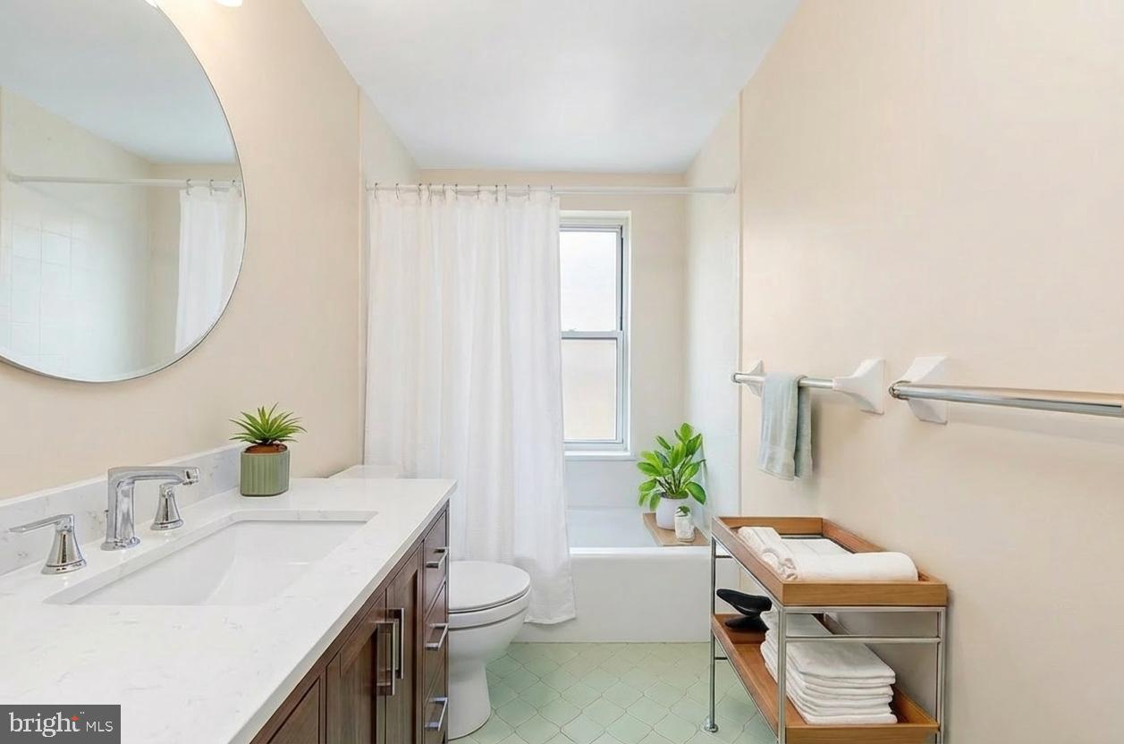 108 Fitzrandolph Avenue Hamilton, NJ 08610 - Photo 17 of 30 a bathroom with a sink toilet and a mirror